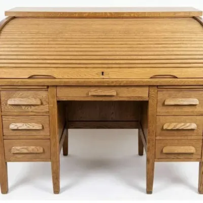 Sale Photo Thumbnail #9: Vintage oak rolltop desk featuring a tambour door, a central drawer, and three side drawers on each pedestal with wooden pulls.