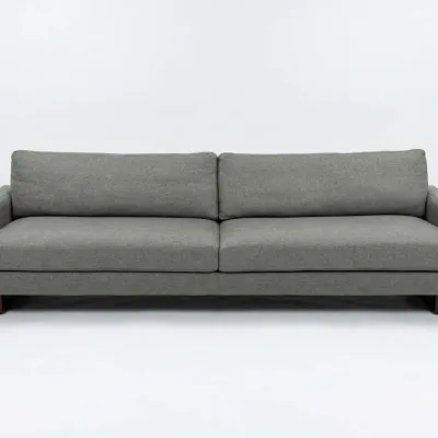 Sale Photo Thumbnail #63: Modern three-seater sofa upholstered in a textured grey fabric, featuring clean lines, track arms, and dark wood block feet.