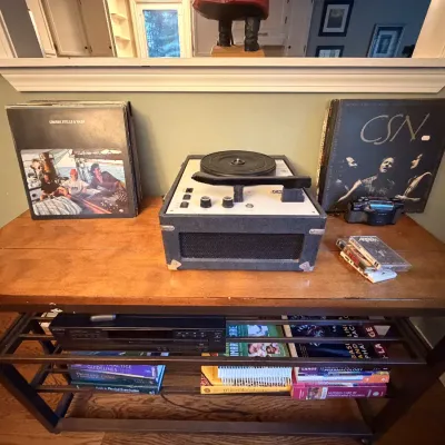 Record player, vintage records, display table, CDs (not displayed)