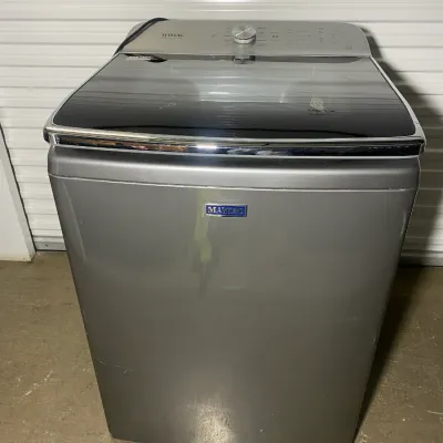 Sale Photo Thumbnail #19: Modern Maytag top-load washing machine in a metallic gray finish with a glass lid.