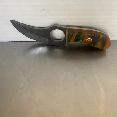 Sale Photo Thumbnail #26: Small custom fixed-blade knife featuring a curved blade with a finger hole and a marbled yellow and green acrylic handle scale with a mosaic pin.