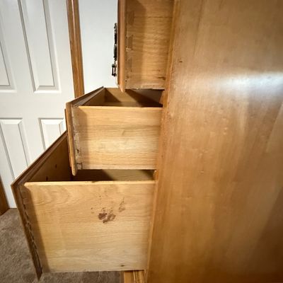 Sale Photo Thumbnail #220: A vintage solid wood chest-on-chest tallboy dresser manufactured by Crawford Furniture of Jamestown, New York. Features a classic colonial style with brass-toned batwing drawer pulls, bracket feet, and a total of seven drawers (including two faux-triple d