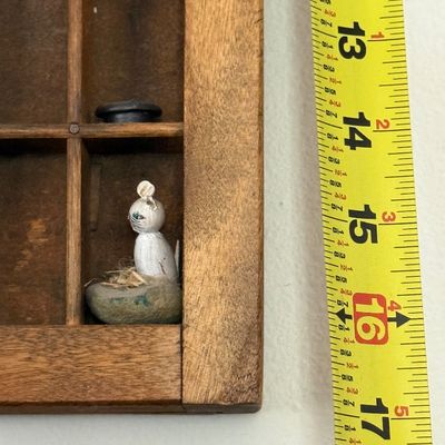 Sale Photo Thumbnail #199: A vintage wooden printer's type drawer repurposed as a hanging shadow box display case. Measures approximately 32 inches wide by 16.5 inches tall. The lot includes a large assortment of miniature collectibles, figurines, and novelty items as shown, includ