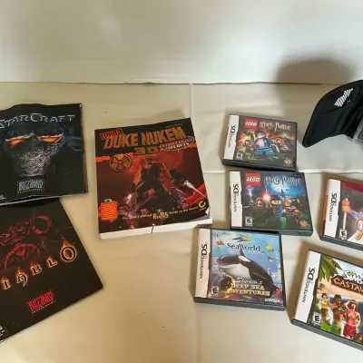 Assorted Video Games And Accessories