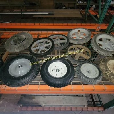 Sale Photo Thumbnail #57: Assortment of replacement utility wheels in various sizes and styles, including pneumatic and solid rubber tires on plastic and metal rims.