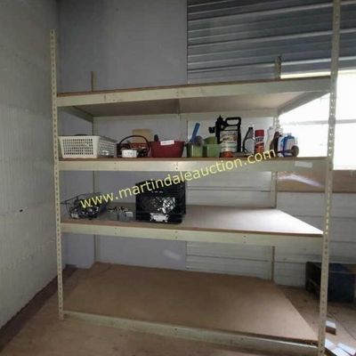Sale Photo Thumbnail #59: Heavy-duty metal industrial shelving unit with four particle board shelves, holding various storage bins and household items.
