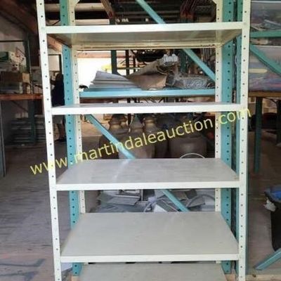 Sale Photo Thumbnail #58: Industrial metal shelving unit with six adjustable shelves, showing some wear and light rust.