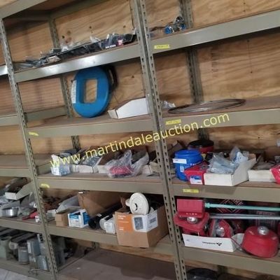 Sale Photo Thumbnail #45: Industrial metal shelving units filled with various workshop items, hardware, and storage bins.