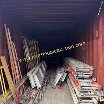 Sale Photo Thumbnail #36: Assorted construction equipment stored in a shipping container, including scaffolding frames, aluminum planks, and extension ladders.