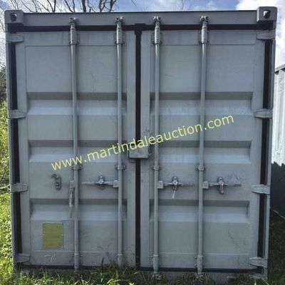 Sale Photo Thumbnail #35: Gray metal shipping container with double locking doors, showing some wear and weathering.