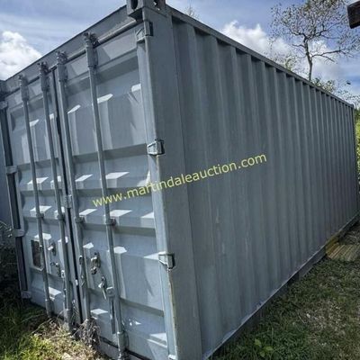 Sale Photo Thumbnail #40: Gray metal shipping container with double locking doors, showing some light exterior wear.