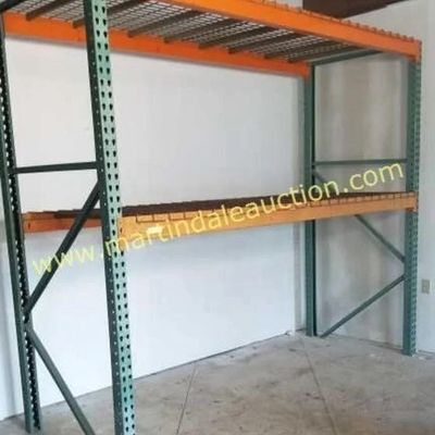 Sale Photo Thumbnail #63: Heavy-duty industrial pallet racking unit featuring green upright frames, orange crossbeams, and wire mesh decking.