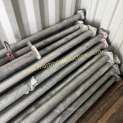 Sale Photo Thumbnail #25: Stack of heavy-duty galvanized steel adjustable shoring jacks, showing some wear from industrial use.