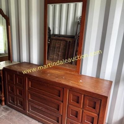 Sale Photo Thumbnail #8: Mid-century modern style wooden dresser with matching vertical wall mirror, featuring geometric square-paneled drawer fronts and a warm oak finish.