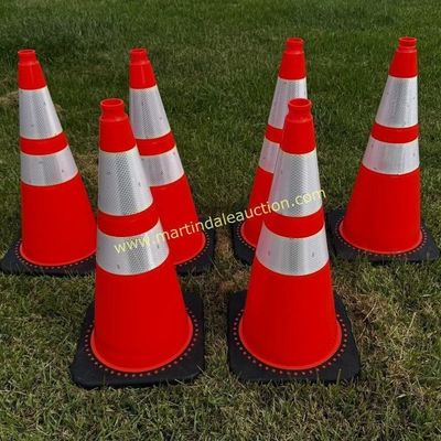 Sale Photo Thumbnail #30: Set of six orange traffic safety cones with reflective silver bands and black rubber bases, shown on a grassy lawn.