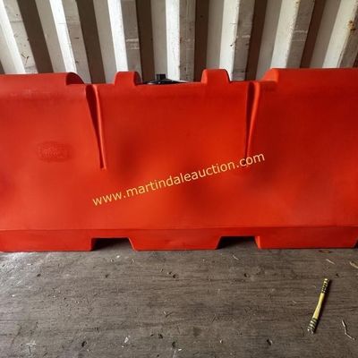 Sale Photo Thumbnail #29: Large orange plastic water-filled road barrier, showing some minor scuffs and wear from outdoor use.