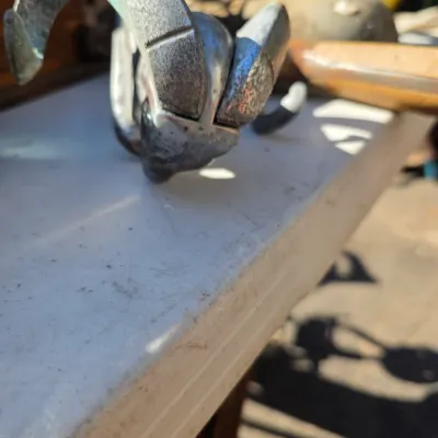 Sale Photo Thumbnail #22: Vintage Dodge ram hood ornament, showing significant wear, pitting, and patina from age.