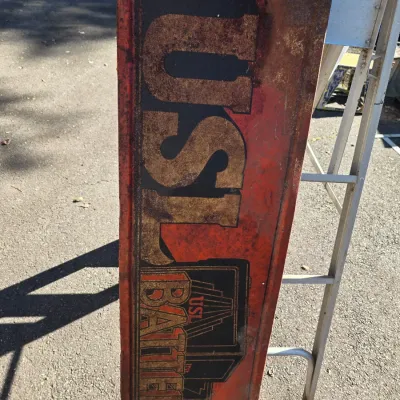 Sale Photo Thumbnail #45: Vintage USL Batteries embossed metal sign, featuring heavy rust, patina, and wear consistent with age.