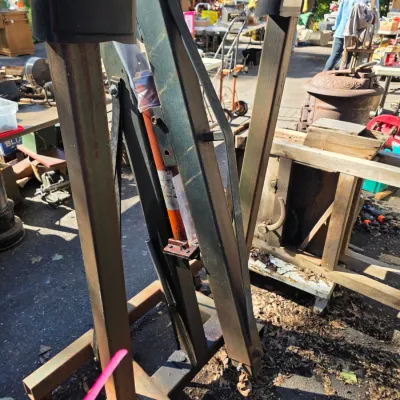 Sale Photo Thumbnail #34: Heavy-duty hydraulic engine hoist, showing some wear and rust from outdoor use.