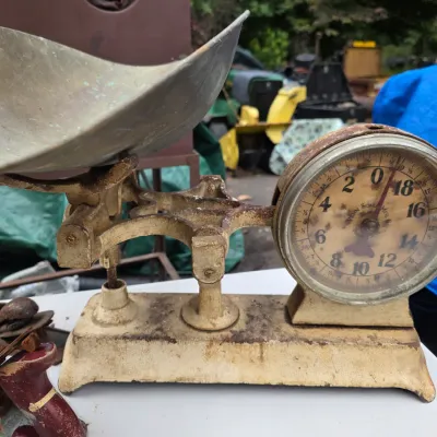 Sale Photo Thumbnail #49: Vintage Penn Scale Mfg. Co. counter scale featuring a cast iron base with distressed white paint, a brass scoop, and a circular dial showing significant patina.