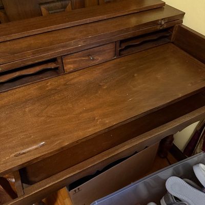 Sale Photo Thumbnail #62: Vintage dark wood spinet desk featuring a flip-top writing surface, built-in mail slots, and a small central drawer.