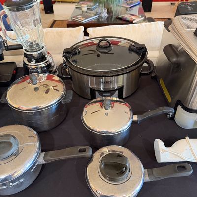 Sale Photo Thumbnail #269: Assorted kitchen appliances and cookware, including a Crock-Pot slow cooker, an Osterizer blender, a T-fal deep fryer, and several Superior brand stainless steel pots with lids.