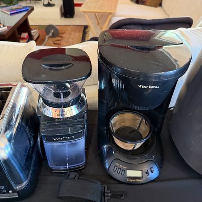 Sale Photo Thumbnail #261: Cuisinart burr coffee grinder and a West Bend Designer Series drip coffee maker, both in black plastic and showing light use.