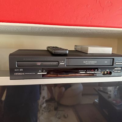 Sale Photo Thumbnail #283: Hitachi DVD/VCR combo player model DV-PF33U, featuring Hi-Fi Stereo and progressive scan, complete with a remote control.