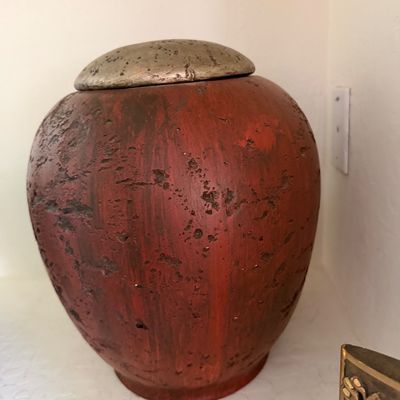 Sale Photo Thumbnail #276: Rustic red ceramic ginger jar with a heavily textured, distressed finish and a metallic silver-toned lid.