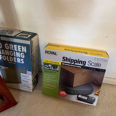 Royal EX315W shipping scale with wireless remote display in its original box, shown next to a box of green hanging folders.