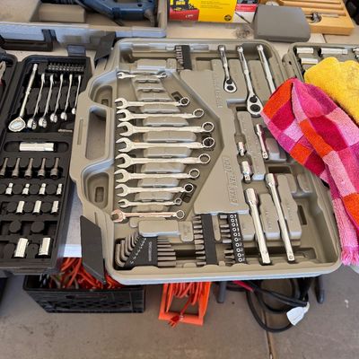 Channellock mechanic's tool set in a gray molded plastic carrying case, featuring a variety of wrenches, sockets, and driver bits.