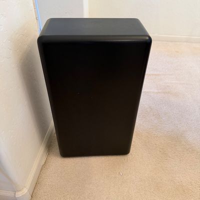 Sale Photo Thumbnail #301: Black rectangular speaker or subwoofer cabinet with rounded edges, shown standing on a carpeted floor.