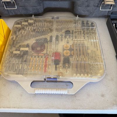 Mastergrip multi-piece drill and drive bit set in a clear-lidded plastic carrying case.