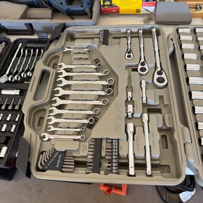 Channellock tool set in a gray molded plastic carrying case, featuring a variety of wrenches, ratchets, sockets, and hex keys.