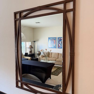 Sale Photo Thumbnail #295: Large rectangular wall mirror featuring a dark wood frame with an elegant geometric overlay design.