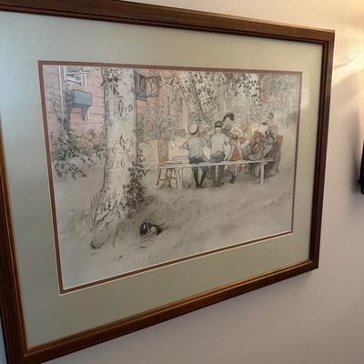 Sale Photo Thumbnail #25: Framed print of Carl Larsson's "Breakfast Under the Big Birch," depicting a family dining outdoors, double-matted in a simple wooden frame.