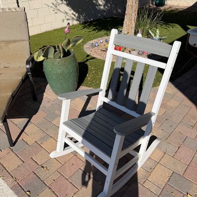 Sale Photo Thumbnail #160: Modern two-tone polywood rocking chair in grey and white, suitable for outdoor patio use.