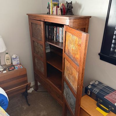 Sale Photo Thumbnail #15: Rustic oak pie safe cabinet featuring punched tin door panels, interior shelving, and a bottom drawer.
