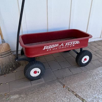 Sale Photo Thumbnail #165: Radio Flyer Big Red Classic ATW wagon with large all-terrain tires and a long black handle, showing some light wear from use.