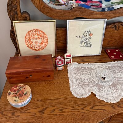 Sale Photo Thumbnail #23: Two framed graphic art prints, a wooden cedar box, and decorative tabletop items displayed on an antique oak dresser with a mirror.