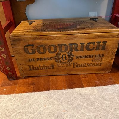 Sale Photo Thumbnail #70: Vintage Goodrich Rubber Footwear wooden shipping crate repurposed as a storage trunk, featuring bold black stenciled lettering and a hinged lid.