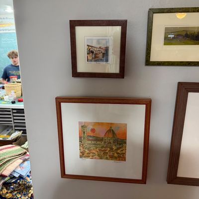 Sale Photo Thumbnail #68: Collection of framed art prints, including a depiction of the Florence Cathedral and a small watercolor of a bridge, both matted and framed in wood.