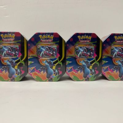 Sale Photo Thumbnail #34: Pokemon Trading Card Game Charizard Tin Set (4 Tins)
