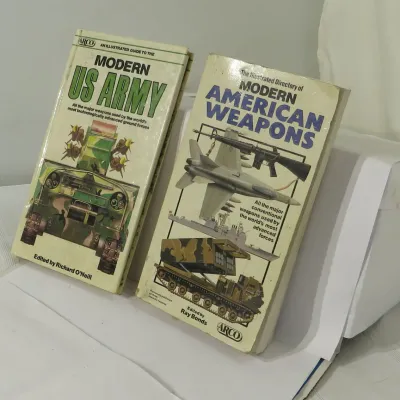 Two vintage military reference books published by Arco, including "An Illustrated Guide to the Modern US Army" and "The...