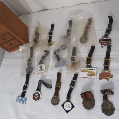 Collection of vintage watch fobs featuring various industrial, transportation, and commercial logos, including ConRail, Allis-Chalmers,...