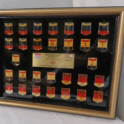 Framed limited edition 1988 U.S. Olympic Team pin set, sponsored by Beatrice/Hunt-Wesson and Philips Lighting Company, featuring various...