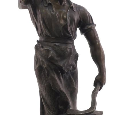 Sale Photo Thumbnail #364: Spelter blacksmith statue with brass tag