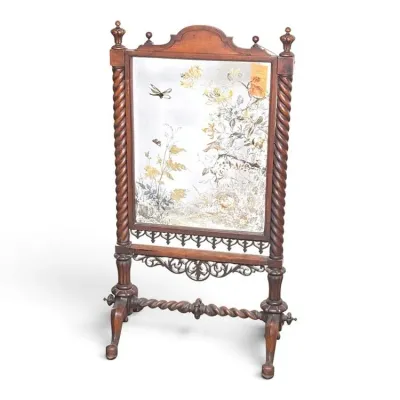 Sale Photo Thumbnail #124: Antique Victorian wooden fire screen featuring barley twist columns, ornate fretwork, and a hand-painted glass panel depicting a nature scene with flowers and a dragonfly.