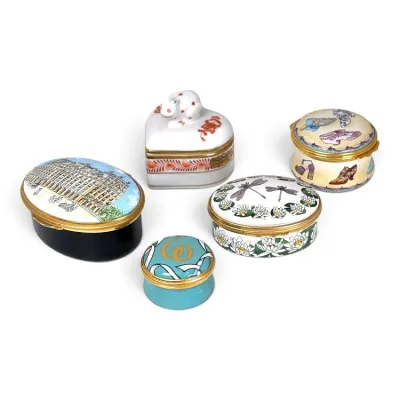 Sale Photo Thumbnail #132: Collection of five decorative porcelain and enamel trinket boxes, including Halcyon Days and Limoges styles, featuring various shapes and hand-painted designs.