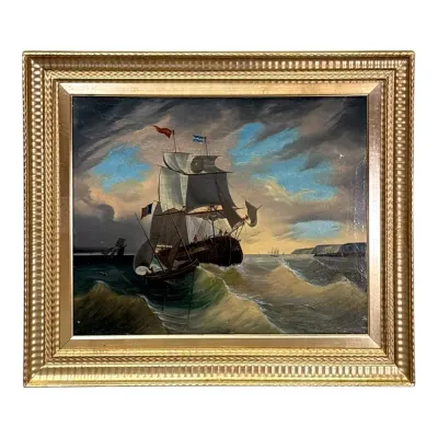 Sale Photo Thumbnail #72: Antique oil painting depicting masted ships on a stormy sea, housed in an ornate, gilded wooden frame.